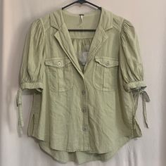 Free People Button Up Balloon Sleeves Size Extra Small Color Light Green Super Cute Top 55% Linen 45% Viscose Ships Out Same Day Price Firm Casual Fitted Blouse With Roll-up Sleeves, Chic Spring Tops With Buttoned Pockets, Chic Fitted Tops With Buttoned Pockets, Casual Short Sleeve Top With Button Cuffs, Casual Green Tops With Button Closure, Casual Spring Shirt With Buttons, Casual Buttoned Shirt For Spring, Spring Linen Tops With Roll-up Sleeves, Fitted Casual Tops With Roll-up Sleeves