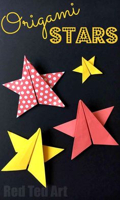 three origami stars on a black background