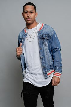 This denim jacket is a perfect pop of color to compliment any outfit! Featuring baseball jacket-inspired design elements, you can coordinate the pop of color on the collar, bottom trim, and sleeve cuff to slay any look. - 100% Cotton - Featuring a faded wash - Distressed threadbare design - Letterman inspired Striped Rib on the collar, bottom hem, and cuff - Front button closures - Front slanted pockets - Back seam construction - Machine wash cold inside-out on gentle cycle with like colors, lin Trendy Varsity Jacket With Baseball Collar For Spring, Spring Varsity Jacket With Baseball Collar And Pockets, Spring Casual Varsity Jacket For College, Trendy Varsity Jacket With Baseball Collar, Casual Cotton Outerwear With Contrast Collar, Blue Cotton Varsity Jacket For Spring, Spring Varsity Jacket With Ribbed Cuffs And Baseball Collar, Urban Cotton Varsity Jacket For Spring, Casual Varsity Jacket With Ribbed Cuffs For Spring