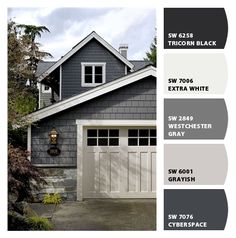 a gray house with two white garage doors and three different color swatches on it