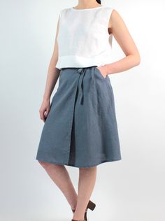 "Handmade natural washed linen wrap skirt. Made with love for You. *100% local medium weight washed linen *Each item is individually cut and sewn by order *The model is wearing size S, skirt color - Grey *Note that colors may look different on your display depending on their settings and technical characteristics. Please let us know if you need different measurements or colors. CARE *Machine wash up to 40 / 104F gentle cycle *Iron inside out at medium high *Do not bleach *Do not tumble dry MAKIN Summer Cotton Wrap Skirt With Pockets, Linen Asymmetrical Skirt With Lining, Casual Linen Wrap Skirt For Spring, Asymmetrical Linen Lined Skirt, Asymmetrical Linen Skirt With Lining, Casual Linen Asymmetrical Skirt, Relaxed Cotton Knee-length Wrap Skirt, Lined Linen Wrap Skirt For Summer, Summer Linen Wrap Skirt With Lining