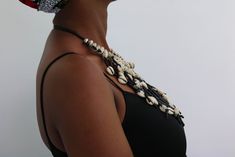 AKALA Cowrie shell necklace, Gift for her

An authentic cowrie shell necklace that can be worn with any outfit.
100% handmade

Closure: hook

Neck width: 18 inches

3-5 days delivery via DHL Express

The shipping fee is for the first item only and additional items ship for free. Traditional Cowrie Shell Beaded Necklaces For Beach, Handmade Cowrie Shell Necklace For Gift, Handmade Shell Necklace For Beach, Unique Handmade Shell Necklace For Beach, Handmade Black Shell Necklace In Bohemian Style, Handmade Black Bohemian Shell Necklace, Handmade Bohemian Black Shell Necklace, Black Necklaces For Vacation, Black Vacation Necklaces