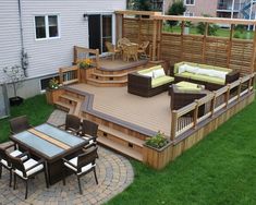 an outdoor deck and patio with seating area