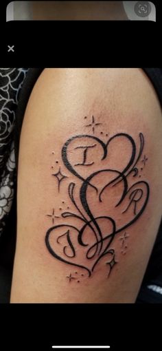 a tattoo with hearts and stars on it