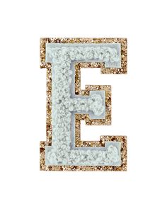 the letter e is made up of white and gold glitters