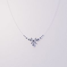 Introducing Blossom: Crafted as a romantic high-end floral necklace to complement any of our other pieces as a set or to shine brightly on it's own. This classical necklace is perfect for any occassion. As a gift for her, a supplement to an engagement ring or a gift for yourself - because you deserve it - it is guaranteed to impress. A bright and shiny string of simulated diamonds make this necklace stand out and is sure to bring lots of compliments. Each stone shines brightly to perfection and Elegant Clavicle Chain Necklace For Mother's Day, Elegant Sterling Silver Bridal Necklace With Sparkling Stones, Elegant Silver Necklace For Wedding, Delicate Diamond White Flower Jewelry, Delicate Cubic Zirconia Necklace With Sparkling Stones, Delicate Necklace With Sparkling Cubic Zirconia, Elegant Silver Necklace With Elegant Design, Elegant Silver Bridal Necklace With Elegant Design, Dazzling Silver Necklaces With Elegant Design