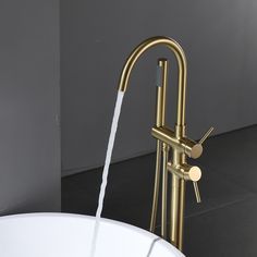 a faucet that is connected to a sink with water coming out of it