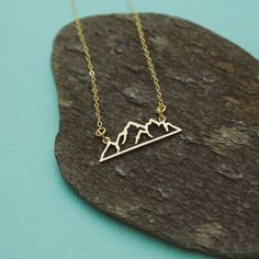 Mountain Necklace Sterling Silver or Gold, Horizontal Bar Necklace, Mountain Range Jewelry, Adventure Jewelry, Mountain Jewelry, Golden Cute sterling silver or 14K gold chain and bronze mountain bar necklace. Perfect for all the adventurers, hikers and outdoorsy people! All of my jewelry is shipped gift wrapped with jewelry care instructions and pro polish pad just perfect for gift giving. Have a lovely day! Thank you for looking at my Etsy shop. Check out the other items in my shop here: https: Nature-inspired Nickel Free Gold Necklace, Horizontal Bar Necklace, Mountain Jewelry, Mountain Necklace, Jewelry Care Instructions, Ruby Earrings, July Birthstone, Copper And Brass, Bar Necklace