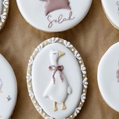 some decorated cookies are sitting on a table