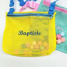 two mesh bags with the word baptsie written on one side and candy in the other