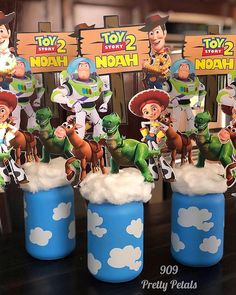 toy story birthday party decorations including cupcake toppers and centerpieces with toy story characters