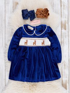 Dress up your little one in this playful Royal Blue Smocked Reindeer Velvet Dress. Featuring embroidered reindeer over a smocked design, this Christmas dress is ideal for your festive family photos. Made with soft blue velvet, this stunning sister set is the perfect Christmas attire. Ho ho how adorable! Fits true to size. 95% Polyester / 5% Spandex Accessories sold separately. Suggest 5 inch bow color: #17 & #19 Import. *Afterpay and Sezzle Purchase Requires $35 Minimum Order. Christmas Attire, Xxxl Dress, Dresses Xxl, The Perfect Christmas, Christmas Dress, Blue Velvet, Velvet Dress, Xl Dress, Perfect Christmas