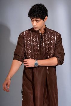 Brown full sleeves kurta crafted in pure dupion silk with floret embroidery using mirror highlights. Paired with a white pant. - Aza Fashions Embroidery Mirror, White Pant, Dupion Silk, Kurta With Pants, Silk Embroidery, Full Sleeves, White Pants, Aza Fashion, Full Sleeve