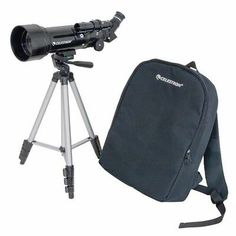 a telescope and backpack sitting on top of a tripod