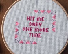 a cross stitch pattern with the words hit me baby one more time