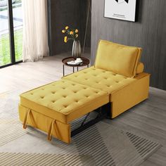 a yellow chaise lounger sitting on top of a rug in a living room