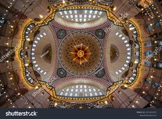 an overhead view of the inside of a building with many windows and lights on it