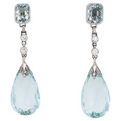 Elegant pair of vintage Art Deco era aquamarine & diamond earrings (circa 1920s to 1930s) crafted in 900 platinum. Briolette faceted aquamarines measure 18mm x 12mm (lower) and square cushion cut aquamarines measure 7mm x 5mm. Four old European cut diamonds total an estimated 0.20 carats (estimated at I-J color and SI1-2 clarity). The opulent earrings transcend eras and are as wearable today as they were nearly 100 years ago. Meticulously crafted in platinum with etched foliate and milgrain deta Opulent Earrings, Mafia Princess, Bijoux Art Deco, Art Deco Jewelry Vintage, 1920s Vintage, Edwardian Jewelry, Silver Jewelry Fashion, Art Deco Earrings, Deco Jewelry