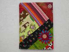 a patchwork piece of cloth with various designs on it