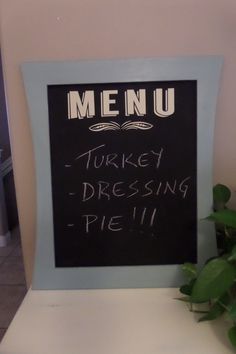 a chalkboard sign that says menu turkey dressing pie on the back of a chair