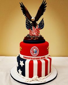 the cake is decorated with an eagle, flag and congratulationss jabob on top