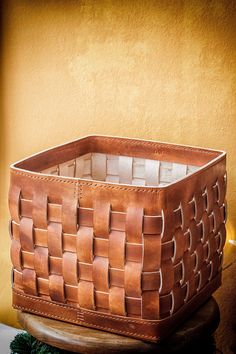 a basket sitting on top of a wooden table