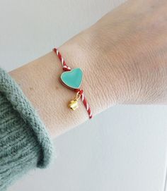 Red white string with turquoise enamel heart and evil eye bracelet, Heart enamel March bracelet, Red and white Spring adjustable bracelet, Greek Martis, March protection bracelet Details: * Gold plated flower bead * Gold plated enamel bead * Red white twisted thread * The bracelet is adjustable The "Marti bracelet" or just "Marti" is an ancient custom for the beginning of Spring. It is believed it dates back to ancient Greece and it is known all over the Balkans. The name is derived from the Gre White Heart Charm Bracelet As A Gift, White Heart Charm Bracelet As Gift, Dainty White Heart Bracelet As A Gift, Dainty White Heart Bracelet As Gift, White Heart Bracelet As A Gift, Handmade Green Heart Bracelets, Handmade Green Heart-shaped Bracelets, Heart Shaped Friendship Bracelets With Heart Beads As Gift, Heart-shaped Friendship Bracelets With Heart Beads As Gifts