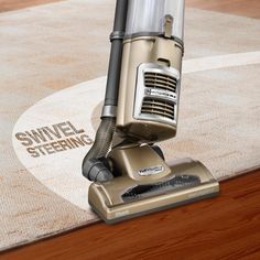 a close up of a vacuum on a rug with the words swivel steering