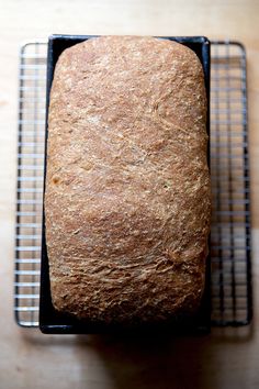 a loaf of bread sitting on top of a cooling rack