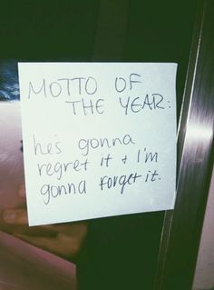 a note attached to a refrigerator door that says moto of the year he's gone