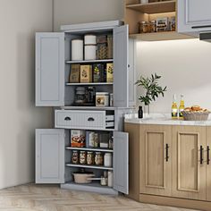 an open cabinet in the middle of a kitchen with lots of cupboards and drawers