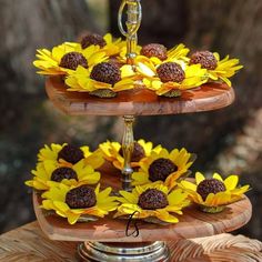 three tiered cake with sunflowers on it