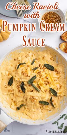 pumpkin cream sauce in a white bowl with sage leaves on top and the words, cheese ravioli with pumpkin cream sauce