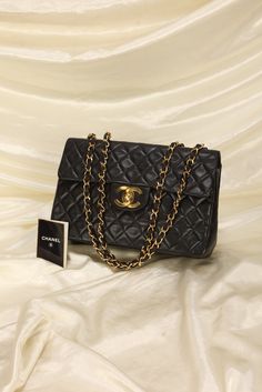 CONDITION: VERY GOOD VINTAGE .?ÿ MAJOR BAG ALERT! This is a Chanel collector's piece!! LARGE CC LOGO made of 24kt gold plating! A gem that is hard to find in this condition! Lambskin is nice and structured, and is able to sit upright!! SOFT lambskin with 24K gold plated hardware. Your new go-to bag due to its versatility. Can be as a shoulder bag or crossbody. Can fit a 13" laptop!! Crafted in 2004-2005. Please note:?ÿSlight hairline scratches on logo. In order to meet the current demand and given the?ÿnature of sourcing inventory, all sales are final. Please be sure to review all pictures and ask any questions prior to making a purchase! To prevent any form of fraud, I?ÿkeep video records of?ÿmyself?ÿpackaging?ÿand dropping off each order, and?ÿall?ÿorders ship with?ÿtracking and?ÿsignatu Chanel Maxi, Vintage Chanel Bag, Chanel Jumbo, Chanel Flap Bag, Girl Backpacks School, Bottega Veneta Shoulder Bag, Dior Shoes, Louis Vuitton Shoes, 24kt Gold