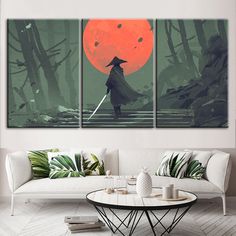 a living room with three pieces of artwork on the wall and one piece of furniture