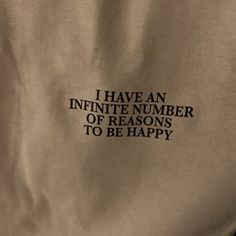 the back of a white shirt that says i have an infinite number of reasons to be happy