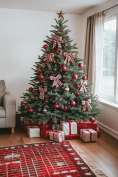 a christmas tree with presents under it