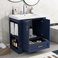 a bathroom with a sink, mirror and towel rack in the corner on the wall