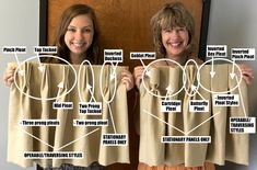 two women holding up curtains with instructions on them