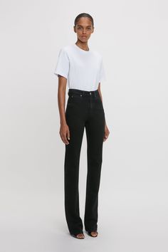 A favourite from the house’s denim library, the Julia Jean is reimagined in a Washed Black stretch denim exclusively for AW24. Characterised by a high waistline, straight leg and relaxed fit, the Julia is tailored from soft 100% cotton denim for a casual but sophisticated look. A silver branded denim shank button and copper branded rivets, tobacco topstitching and a branded leather patch at the back of the waist reflect the house’s consistent attention to detail. Styled with the Victoria T-Shirt Straight Leg Jeans Black, High Waisted Jean, Shank Button, Straight Fit Jeans, Leather Patches, Black Stretch, Jean Outfits, Rivets, Victoria Beckham