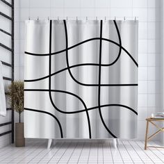 a white shower curtain with black lines on it