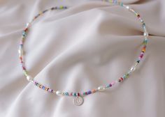 Precious and Colorful Initial Choker Necklace. Perfect as a gift or a beautiful piece to wear in this season of the year    ♡ Beads: Colorful Seed Chaquira.   ♡ High Quality Pearls Grade AAA    ♡ Silver Beads and components: .925 Sterling Silver   ♡ Hypoallergenic   ♡ Long Lasting   ♡ 1in Extender PEARLS: Grade AAA is the Highest Quality of non-round shape pearls.          C A R E ∙ T I P S To maintain the Perfect Quality of your new Velvet Collection Necklace, please: * Wash your necklace with Rainbow Letter Beads Necklaces For Summer, Rainbow Letter Beads Necklace For Summer, Rainbow Colored Letter Beads Necklace For Summer, Summer Rainbow Letter Beads Necklaces, Summer Rainbow Letter Beaded Necklaces, Colorful Letter Beads Necklace Gift, Personalized Multicolor Bohemian Necklace, Colorful Handmade Necklace For Birthday, Beaded Necklaces With Colorful Beads For Birthday