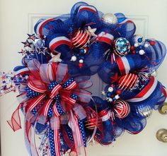 a patriotic wreath with red, white and blue decorations