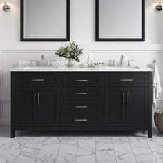 two mirrors are above the double sink vanity in this white and black bathroom with marble flooring