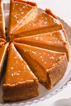 there is a cake that has been cut into slices and sits on a white plate