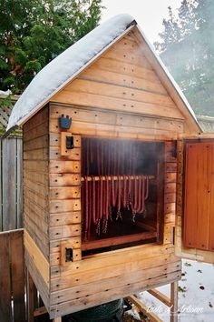 a wooden shed with hot dogs in it