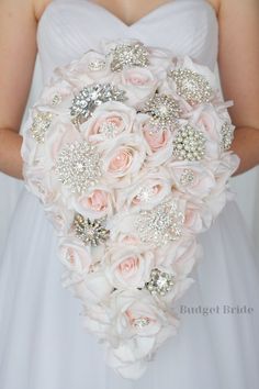 a bride holding a wedding bouquet in her hands