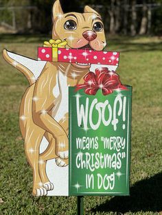 a wooden sign with a dog holding a christmas present