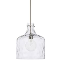 a glass light hanging from a ceiling fixture