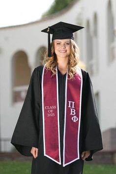 a woman wearing a graduation gown and cap